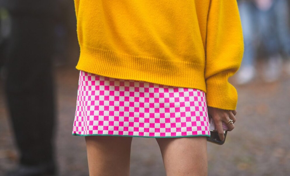 Woman in checkered skirt